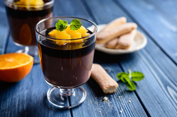 Chocolate pudding topped with orange pieces