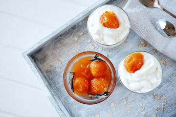 Oats layered with spicy apricot jam. Healthy food concept.