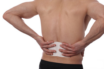 Medicated pain relief patch, plaster. man with back pain. Pain relief and health care concept...