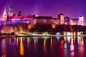 Royal castle of the Polish kings on the Wawel hill, over the Vistula river in the evening, Krakow, Poland