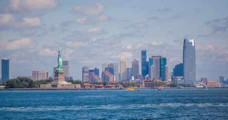 The Liberty Island and New York City Manhattan Financial District - view from the Staten Island ferry