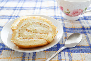 Homemade sponge roll with cottage cheese cream 