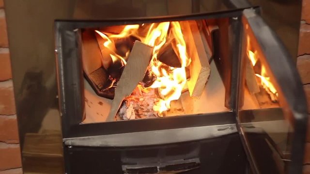 Sauna fire place burning.
