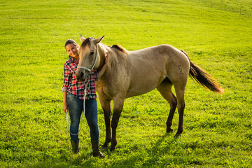 Naklejka premium Girl with a blue and red mapped shirt with a horse in Slovakia