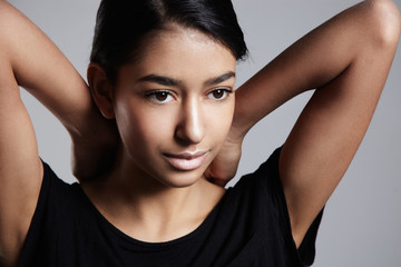 mixed race woman's portrait with ideal shining skin and healthy hair