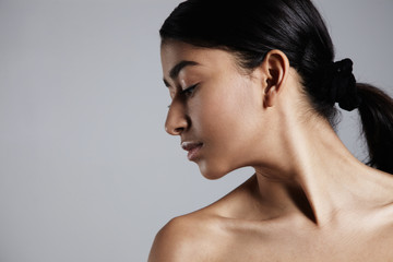 mixed race woman's portrait with ideal shining skin and healthy hair