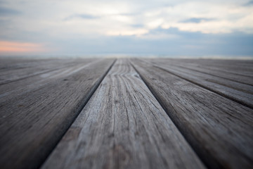Close up old wooden flooring and tropical beach