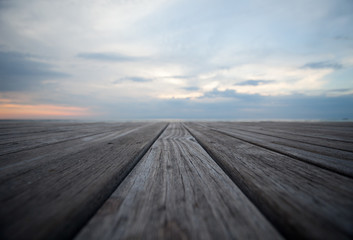 Fototapeta na wymiar Close up old wooden flooring and tropical beach