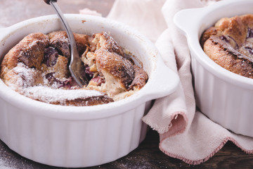 French dessert cherry clafoutis in ceramic ramekins
