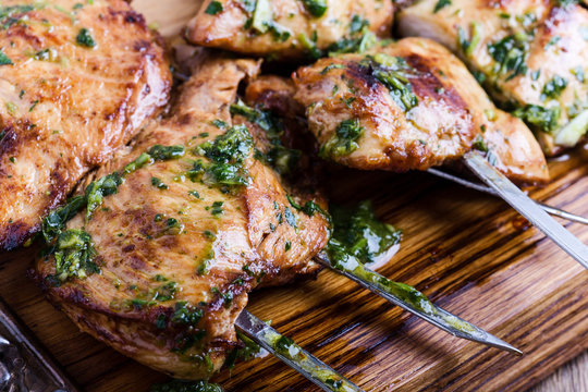 Grilled chicken skewers with chimichurri sauce