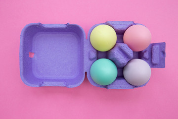 Easter eggs box on pink background