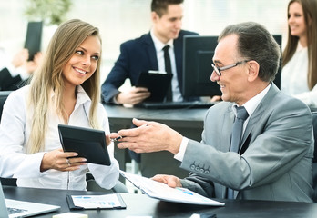 successful businessman and his assistant discuss the work plan