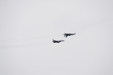 Air show in the sky above the Krasnodar airport flight school. Airshow in honor of Defender of the...