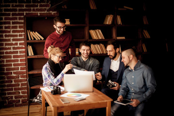 team of copywriters discussing a new advertising project