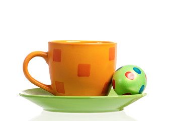 One cup with Easter egg, isolated on white background