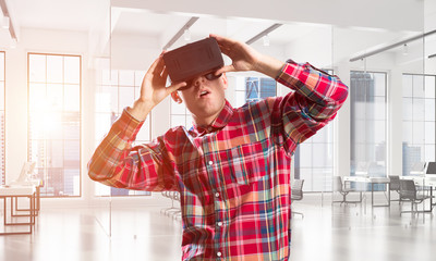 Concept of modern entertaining technologies with man wearing virtual reality mask