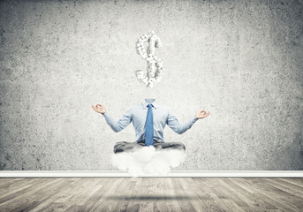 Headless meditating businessman