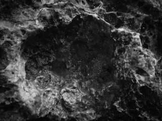 Black stone natural texture background surface, close up image