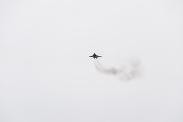 Air show in the sky above the Krasnodar airport flight school. Airshow in honor of Defender of the Fatherland. MiG-29 in the sky.