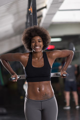 black woman doing parallel bars Exercise