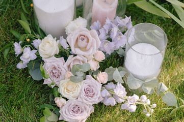 A beautiful bouquet of roses on green grass outdoors