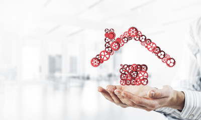 Symbol of homepage or accomodation made with cogwheels presented