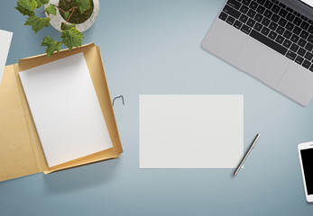 Top view of blank white paper sheet with office tools. Workspace mock up