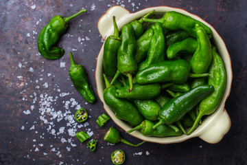 Raw green hot mexican peppers jalapeno pimientos padron spanish tapas