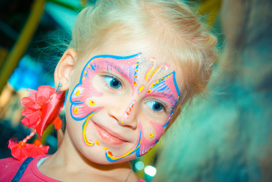 Pretty Girl Child with face painting. Make up.