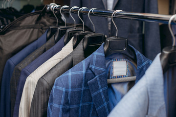 Blue man jackets on hanger