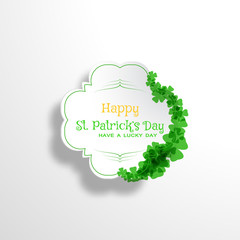 Happy St. Patrick's Day vector card on the gradient gray background with label cut from paper, shadow, text and clover leaves arranged at the border.