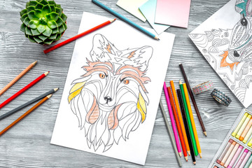 coloring picture for adults on wooden background top view