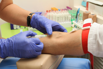 Taking blood in the laboratory for analysis
