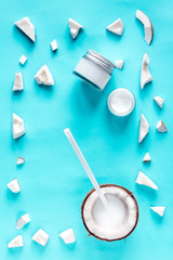 concept organic cosmetics with coconut on blue background top view