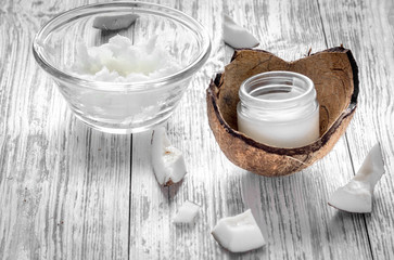 organic cosmetics with coconut on wooden background close up