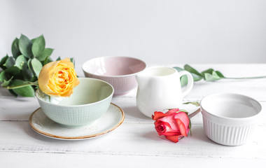 ceramic tableware with flowers on white background