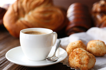 Cup of coffee and different bakery products