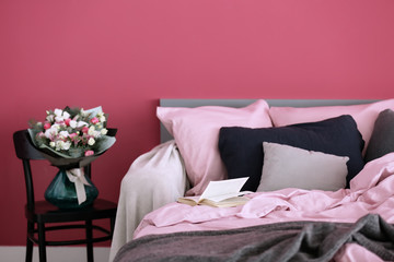 Fototapeta na wymiar Interior of modern bedroom with cozy double bed