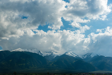Clouds and mountains after the winter season in skiing resort