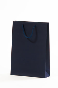 Dark blue, black paper bag on a white background