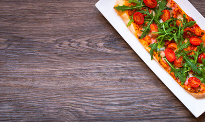 Home maid fresh pizza with tomatoes, rucola and mozzarell