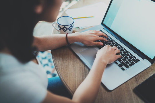 Closeup View Of Young Asian Woman Working On Laptop While Spending Time At Home.Concept Young Modern People Using Mobile Devices.Blurred Information On Notebook Screen.