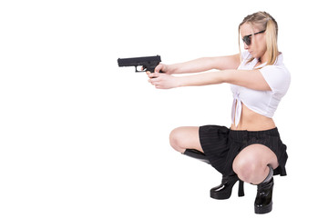 Sexy woman holding gun, isolated on white background.