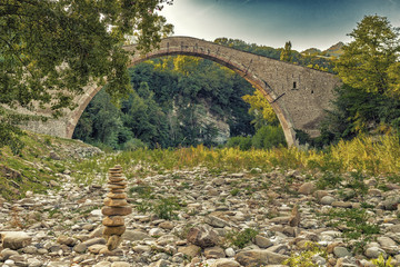 pile of stones  and hog-backed bridge