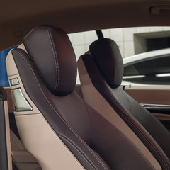 Modern car interior detail. Leather seats.