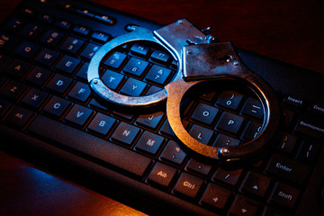 computer keyboard and handcuffs