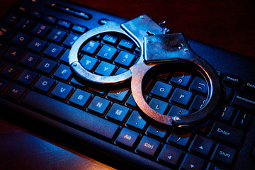 computer keyboard and handcuffs