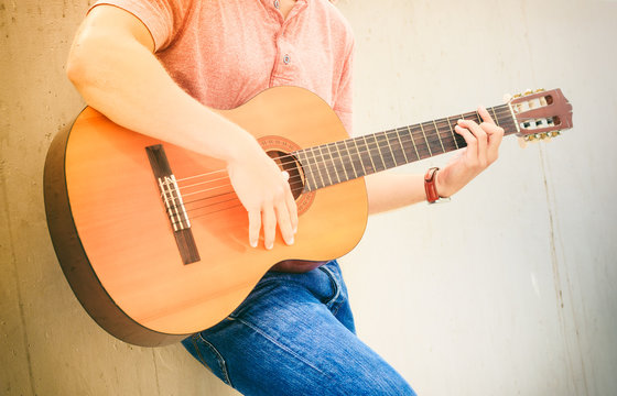 Trendy guy with guitar outdoor