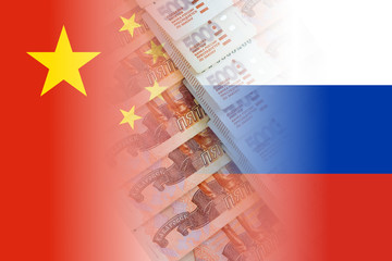 china and russia flags with ruble banknotes mixed image