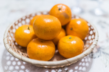 Closeup bowl of clementine mandarin oranges on table